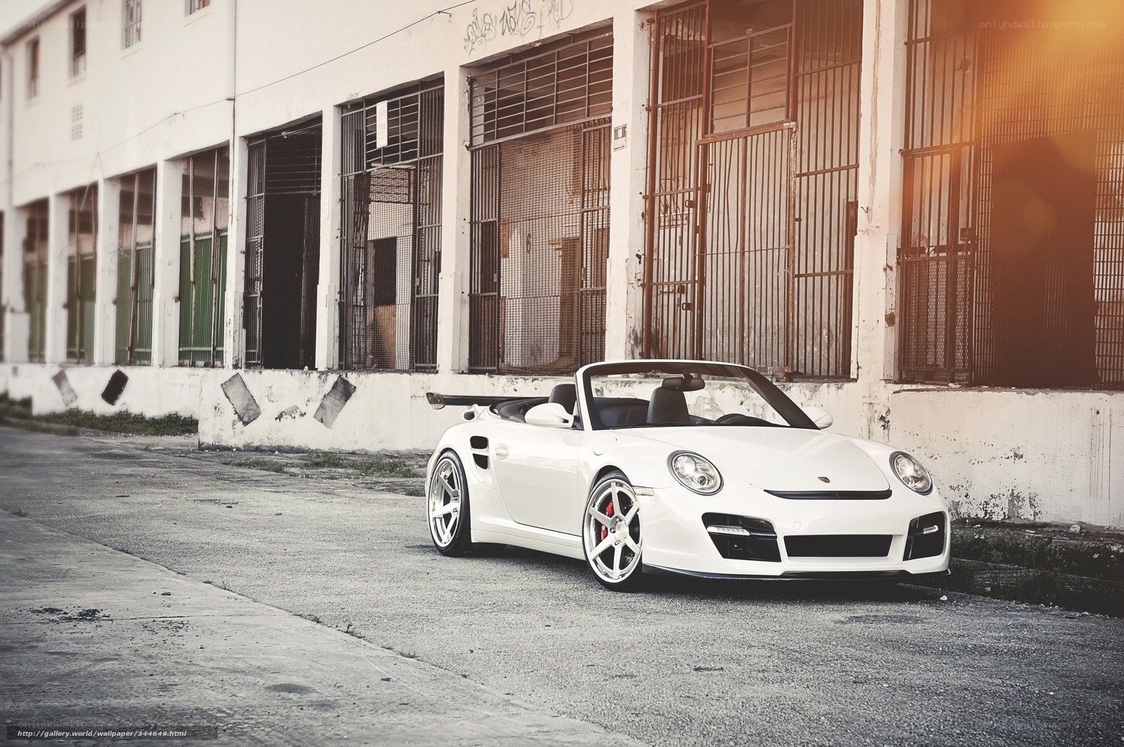white porsche parked in alley