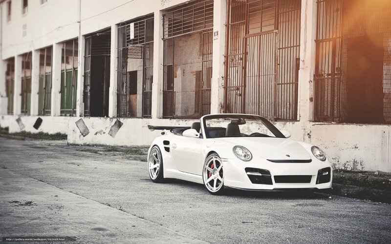 white porsche parked in alley
