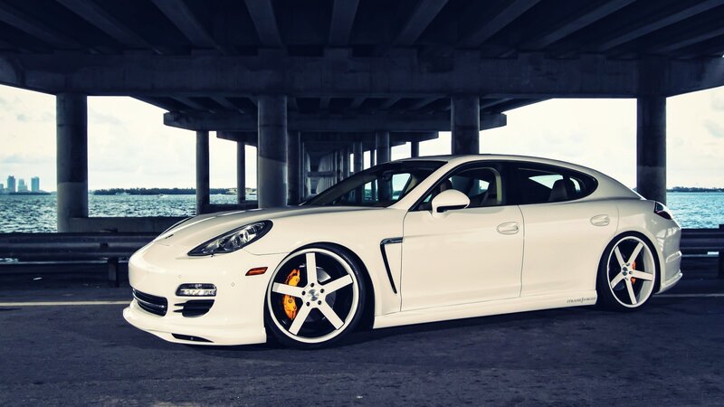 white porsche parked under bridge