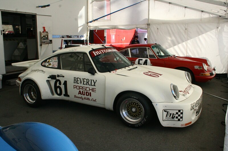 White Porsche race car at a track