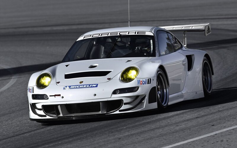 White Porsche race car on track