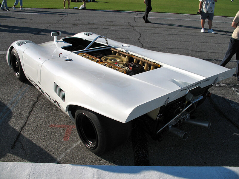 White Porsche race car on track