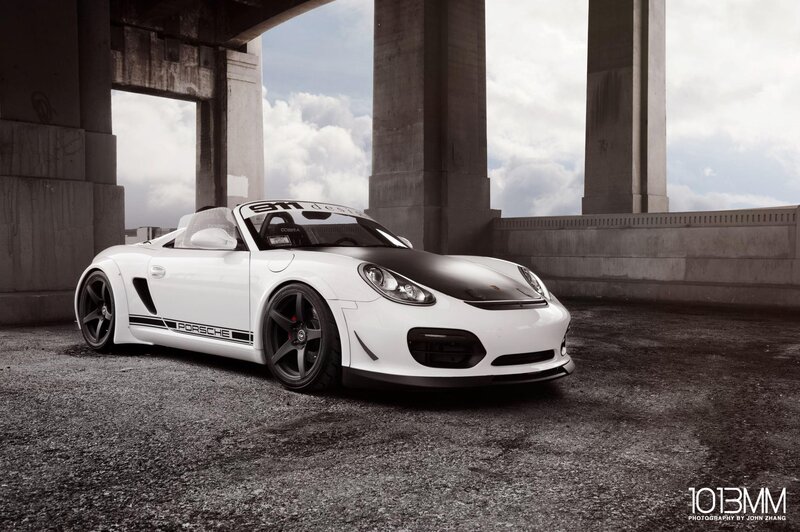 White Porsche sports car under bridge