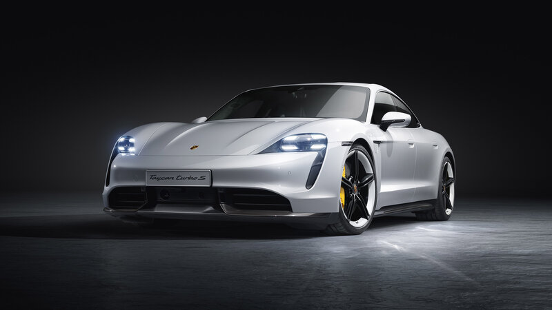 White Porsche Taycan Turbo S — Dramatic
