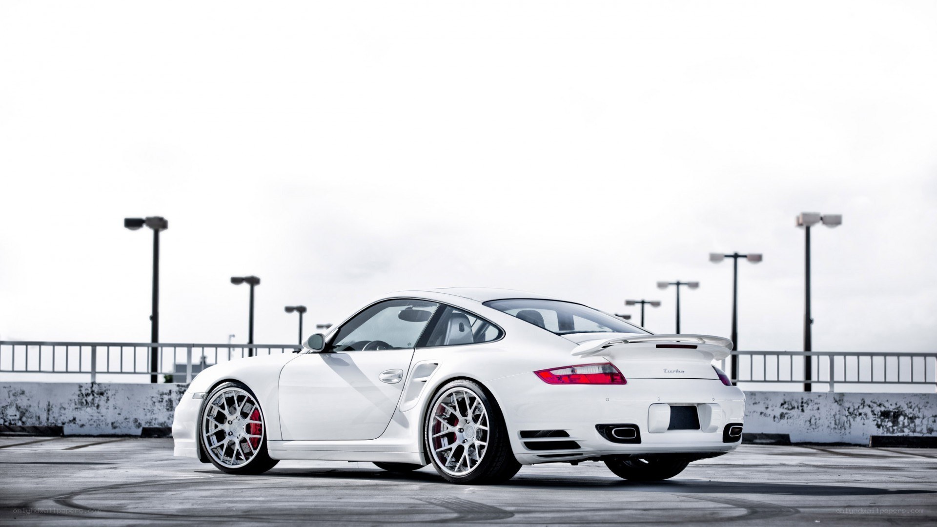 White Porsche Turbo parked