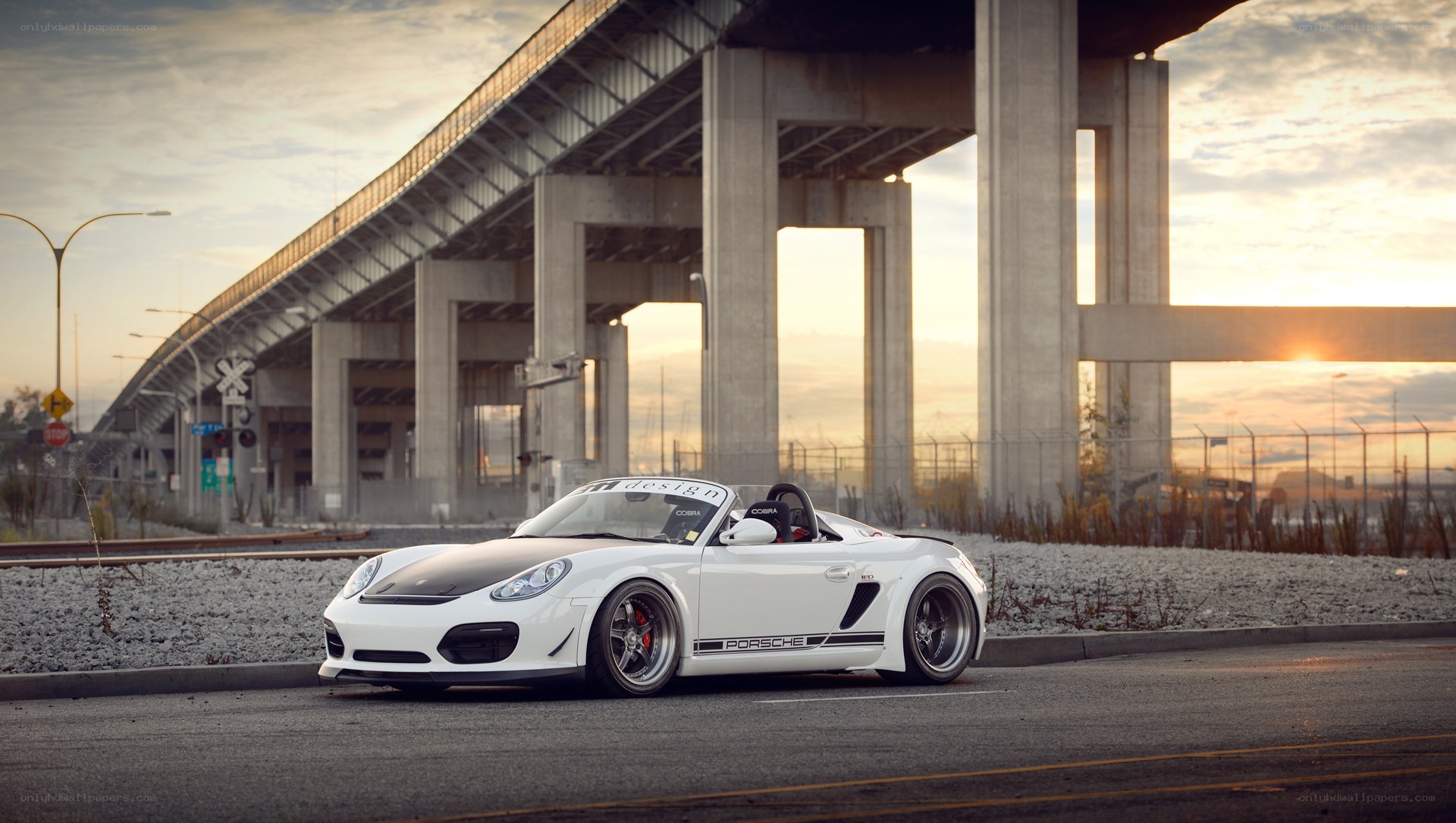 White Porsche under a bridge