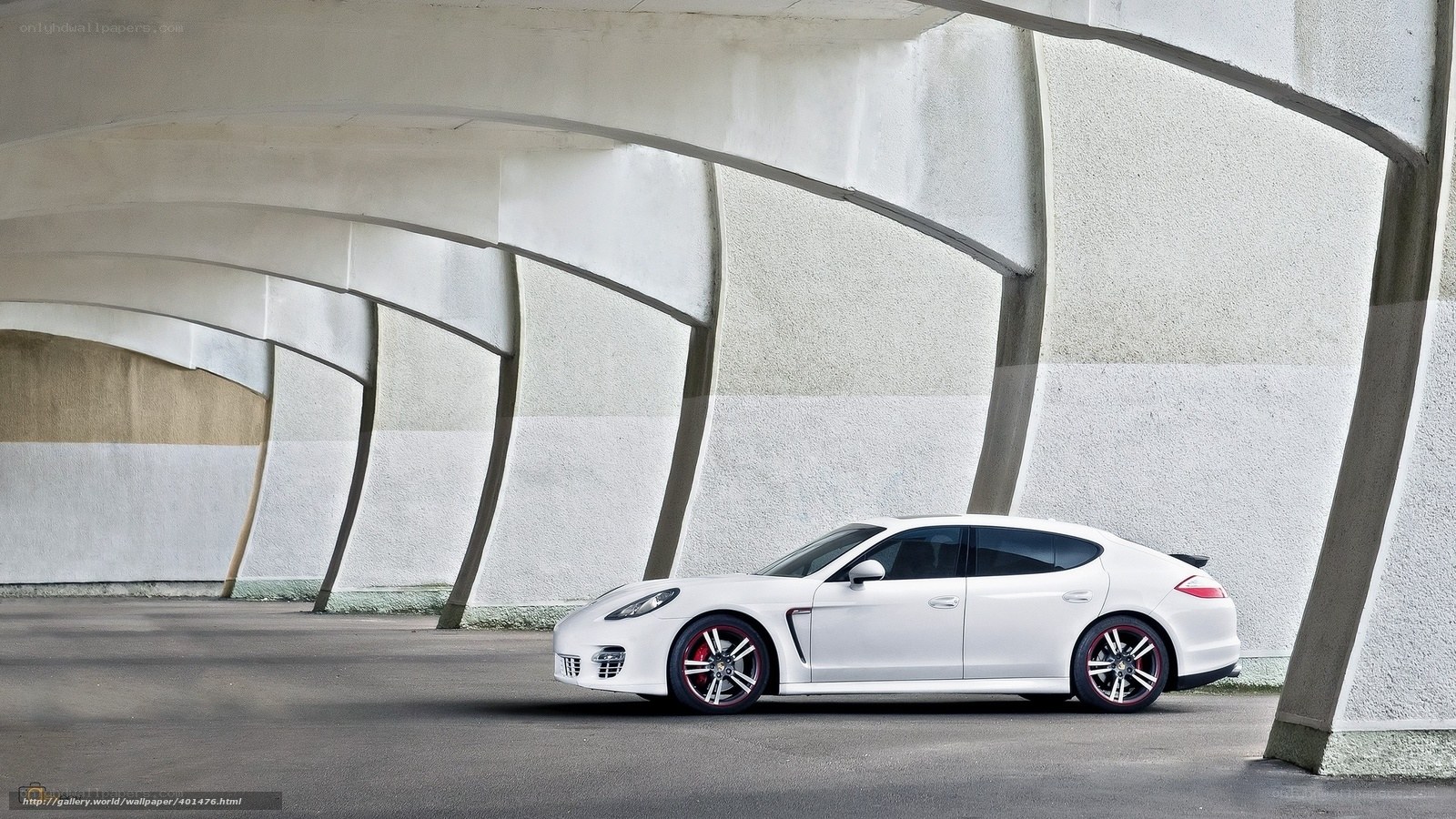 White Porsche under concrete arches