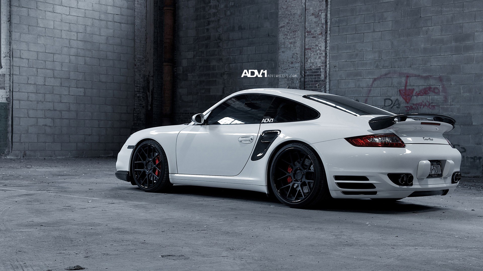 white porsche with black wheels