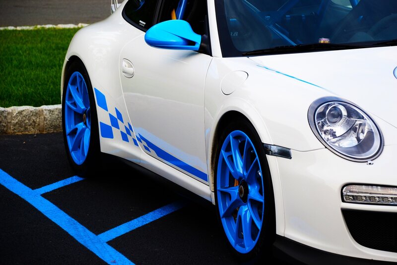 White Porsche with blue accents