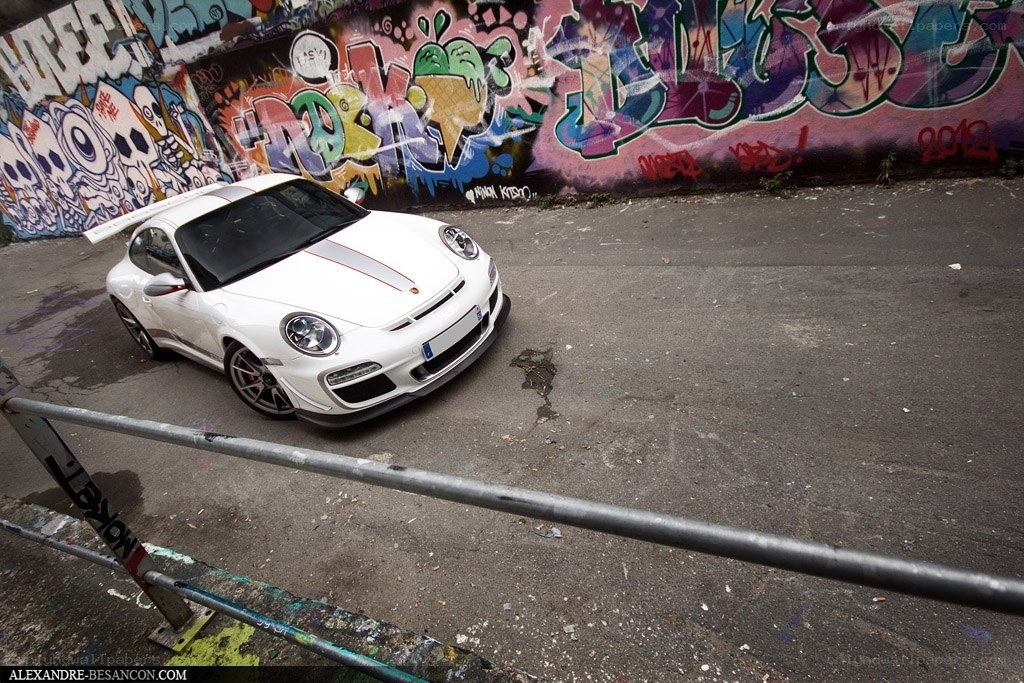 White Porsche with graffiti background