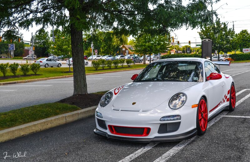 White Porsche with red accents