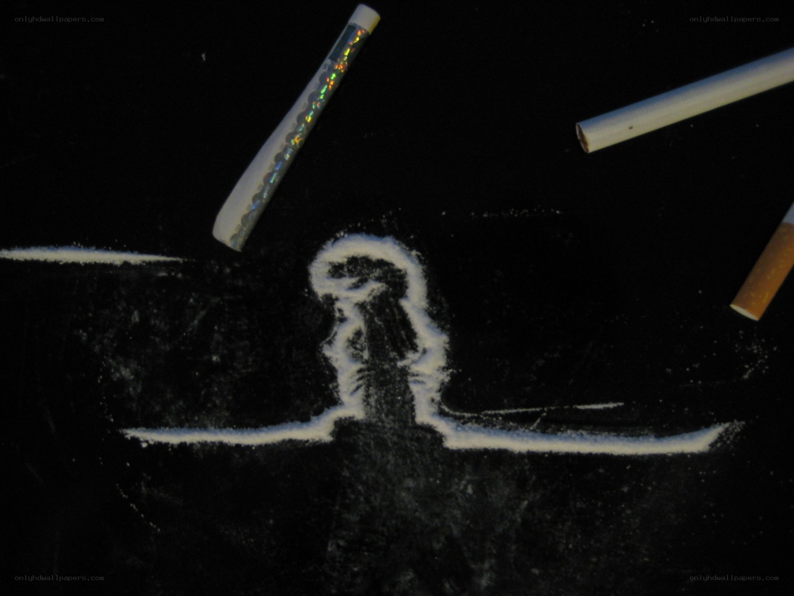 white powder lines on black surface