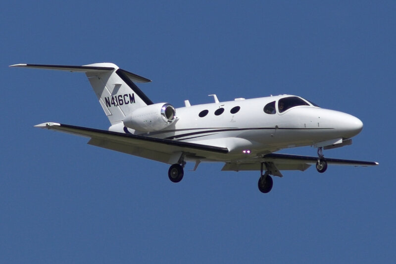 White Private Jet in Flight — Blue
