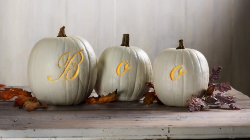 White pumpkins with monogram letters