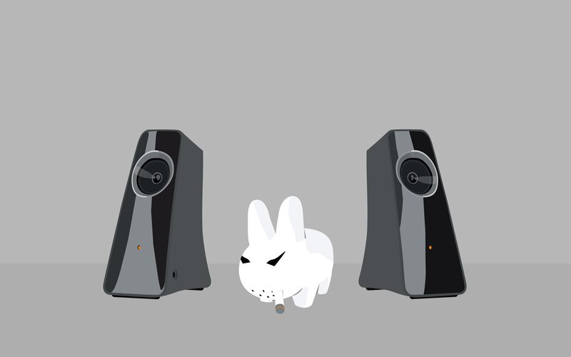 white rabbit between speakers