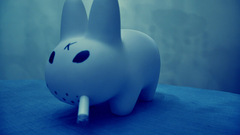 white rabbit figurine with cigarette