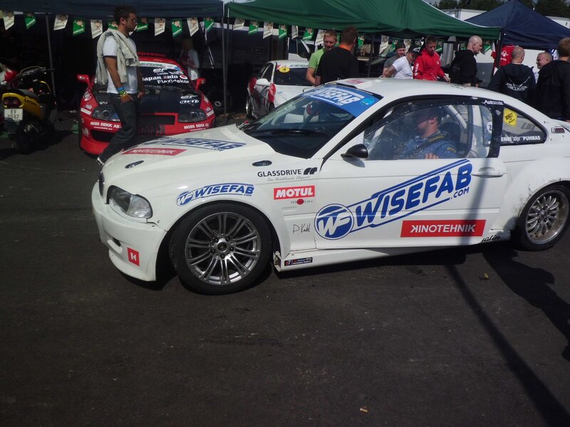 White race car at a motorsport event