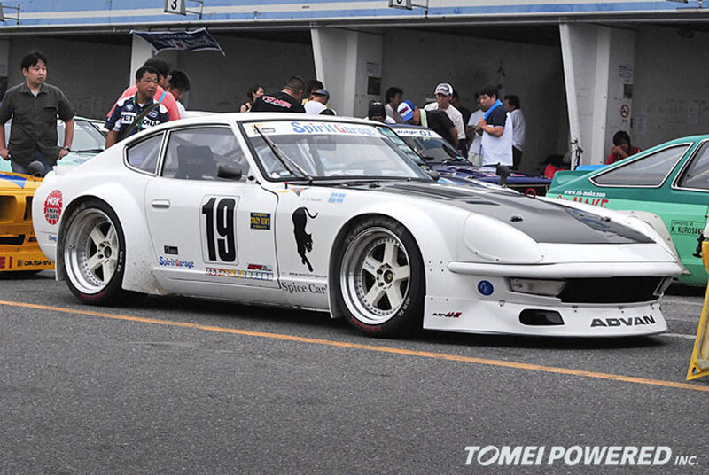 white race car at a track