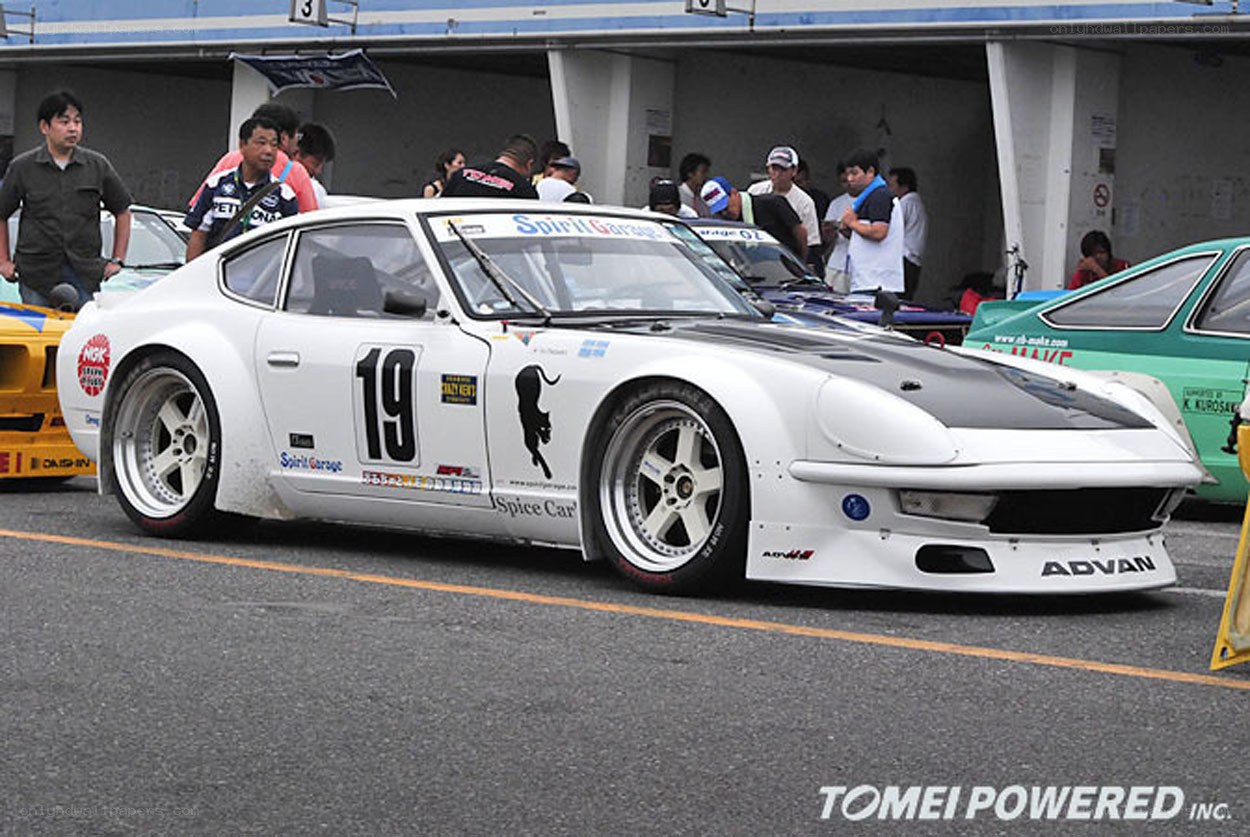 white race car at a track