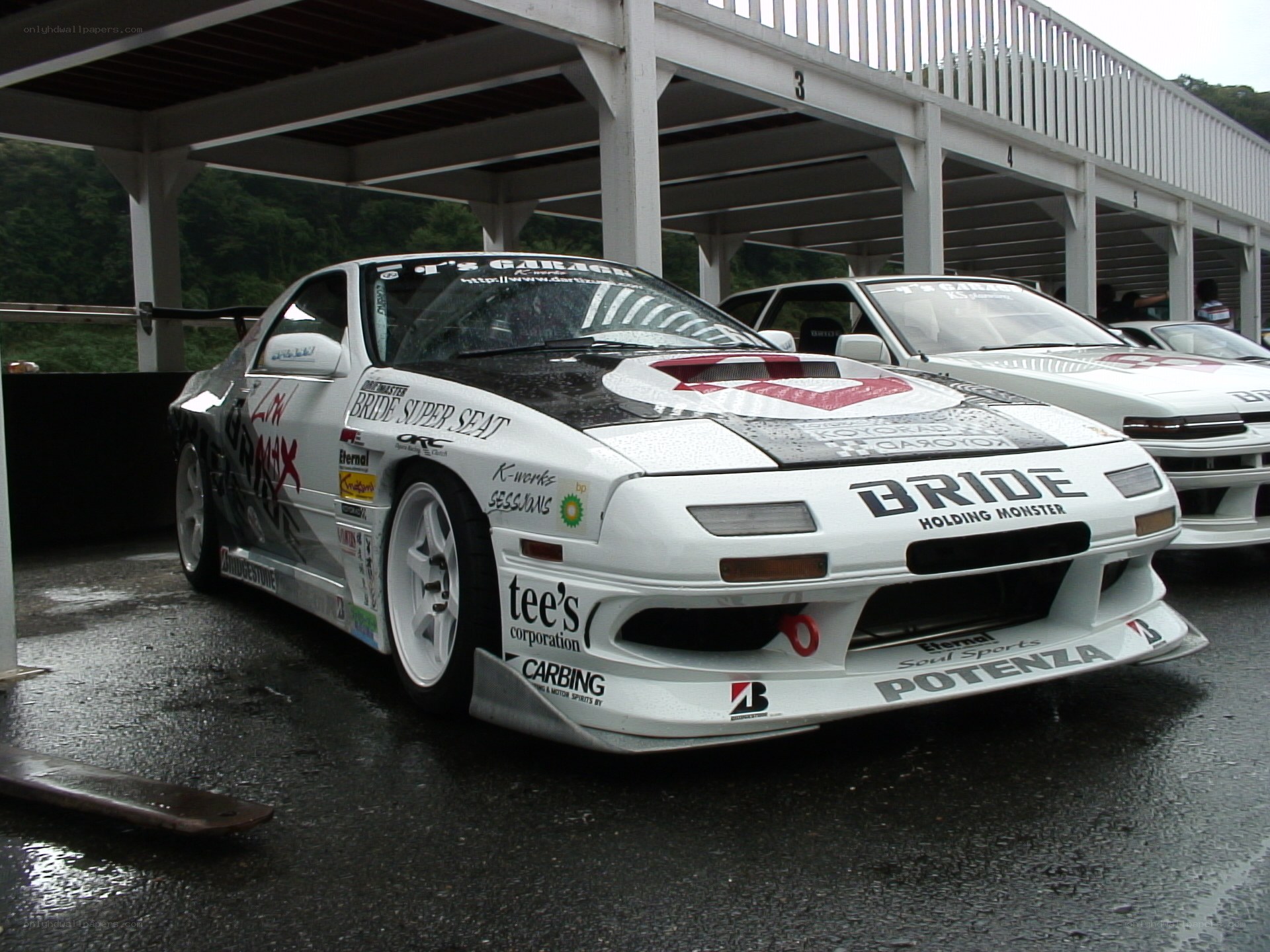 white race car at a track