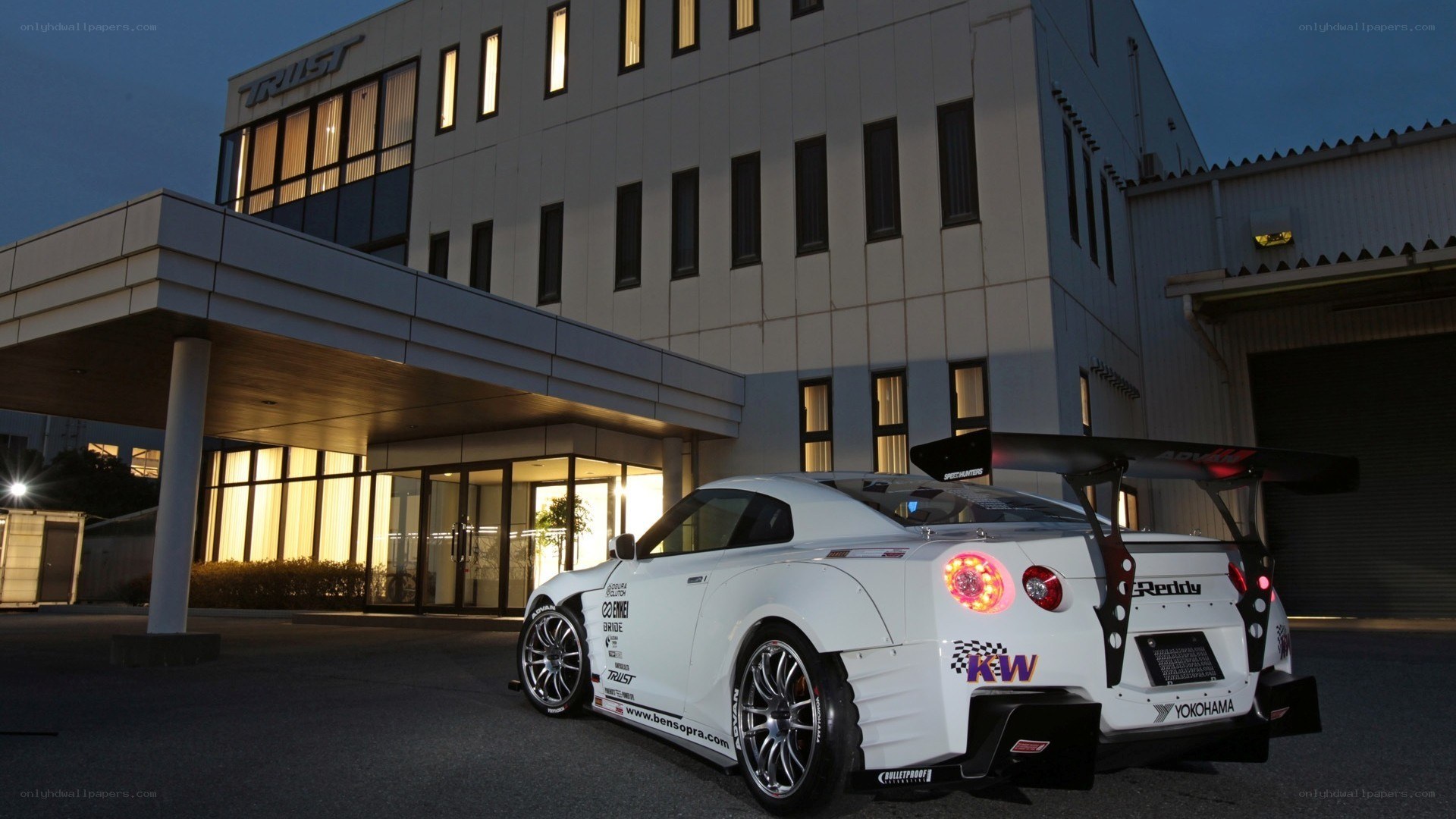 white race car at building