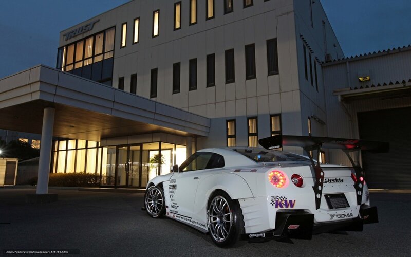 white race car at building