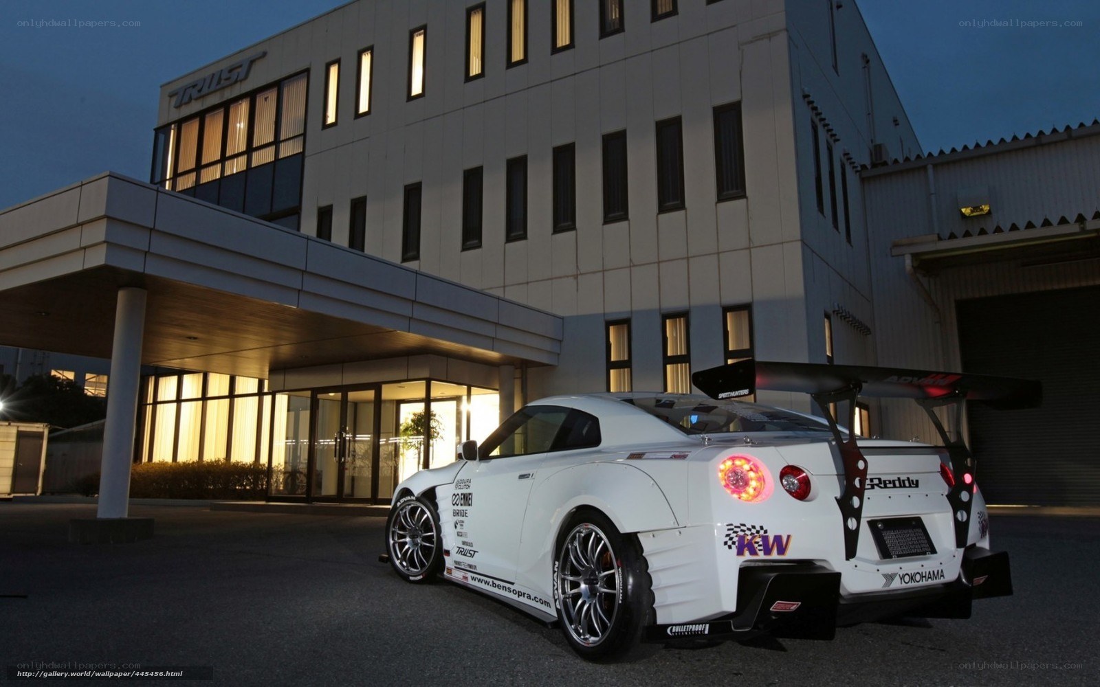 white race car at building