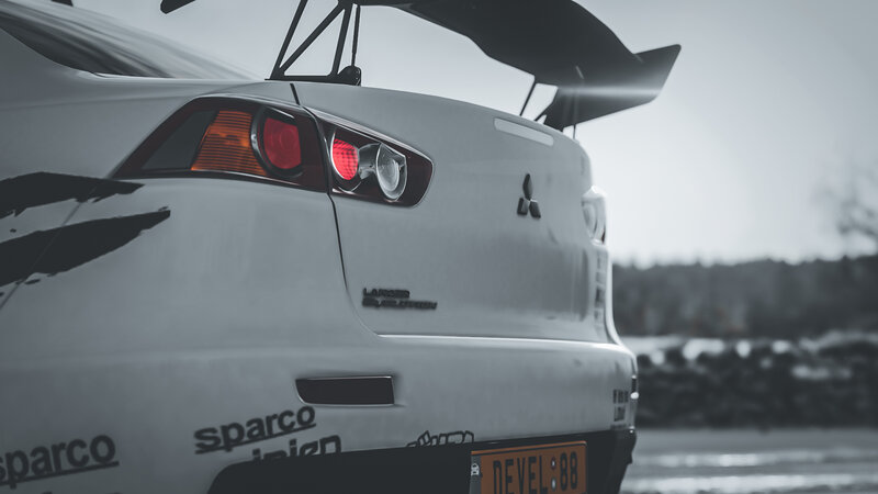 White Race Car — Dramatic, Photograph, Taillight