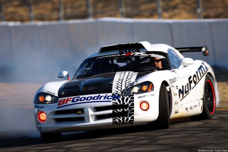 White race car drifting on track