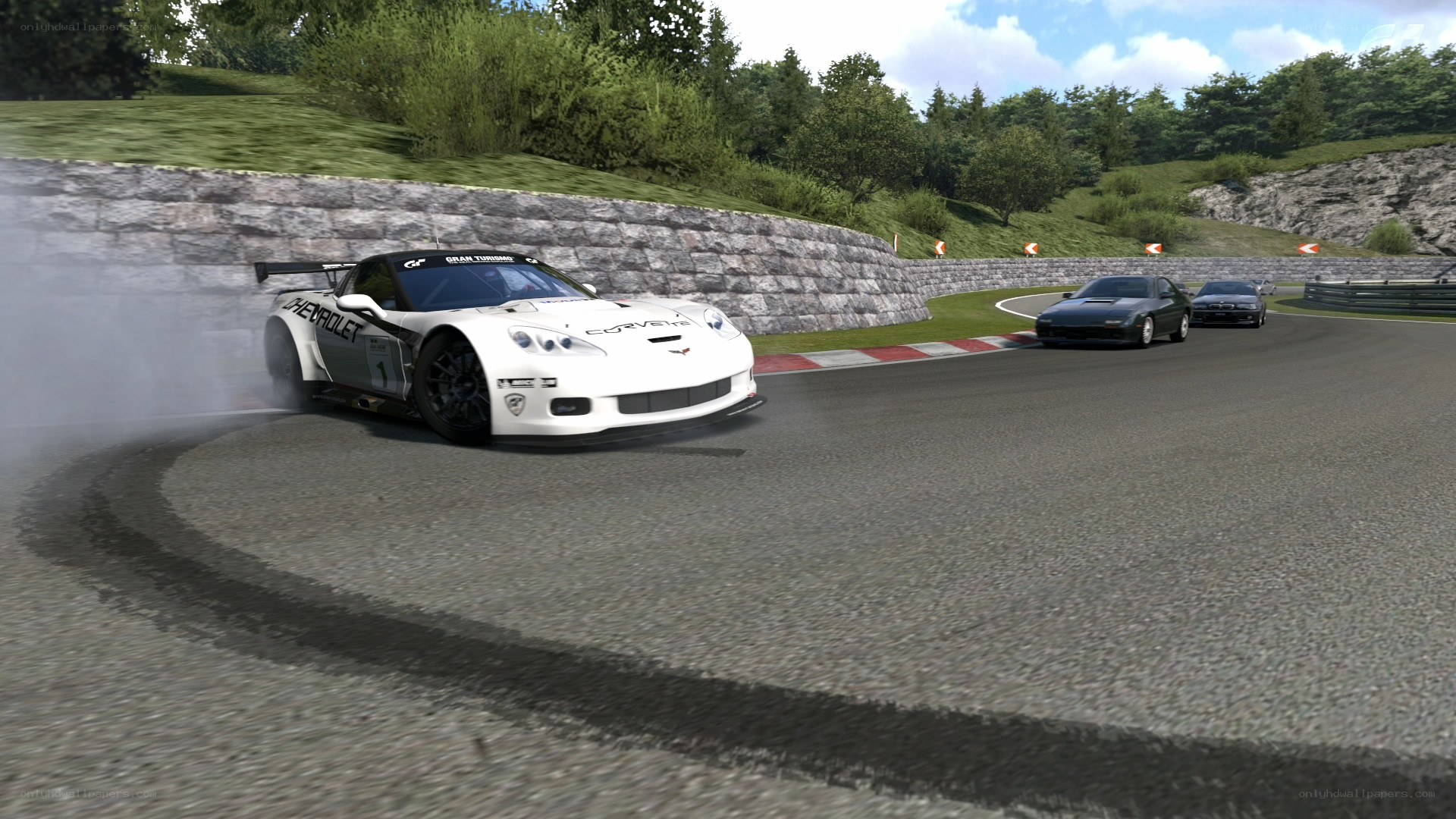 White race car drifting on track