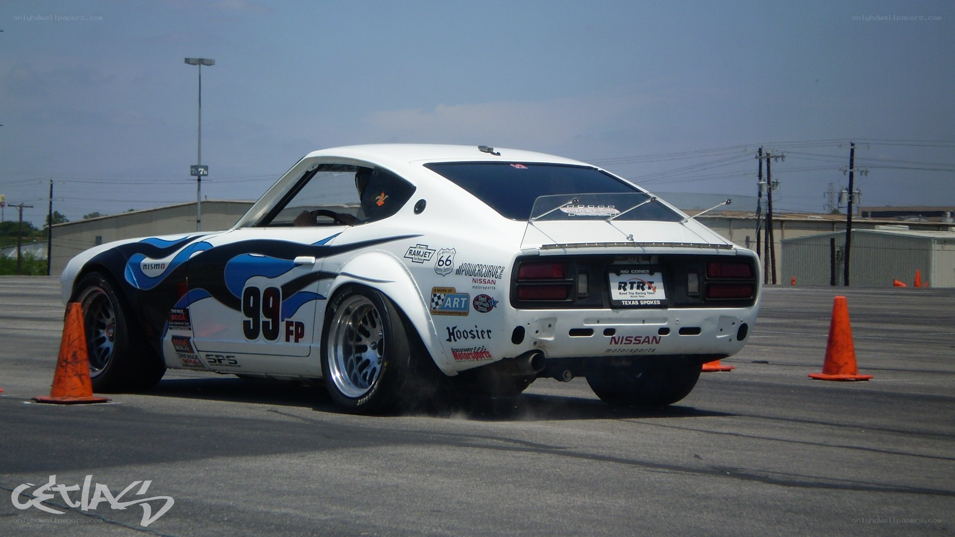 white race car drifting
