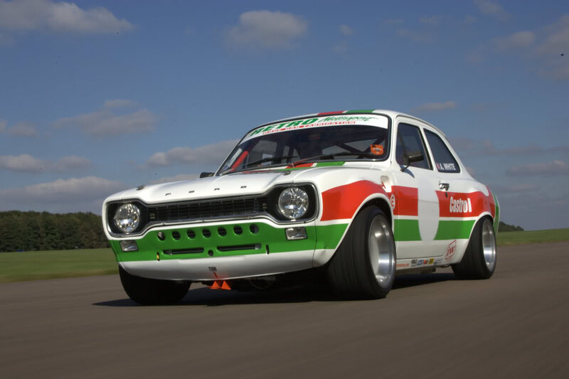 White Race Car — Dynamic, Afternoon, Photograph, Race Track, Green Field