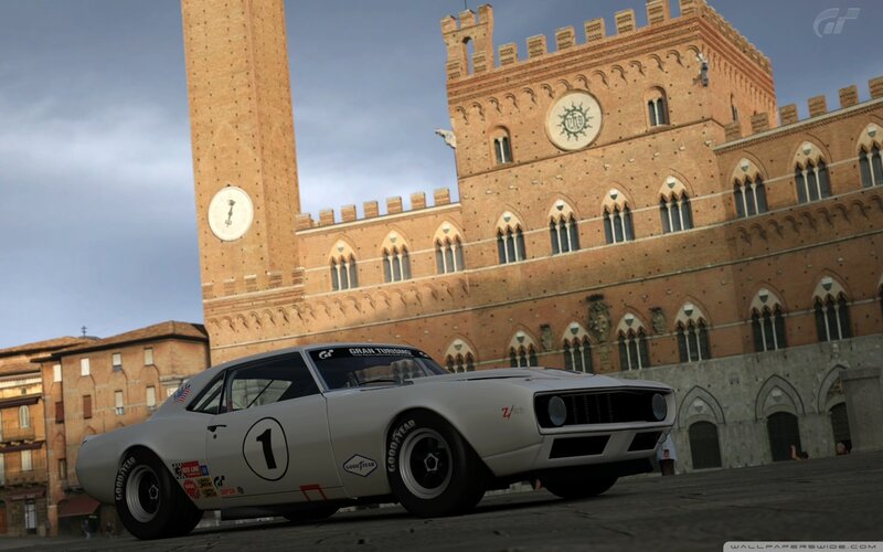 White race car in a city square