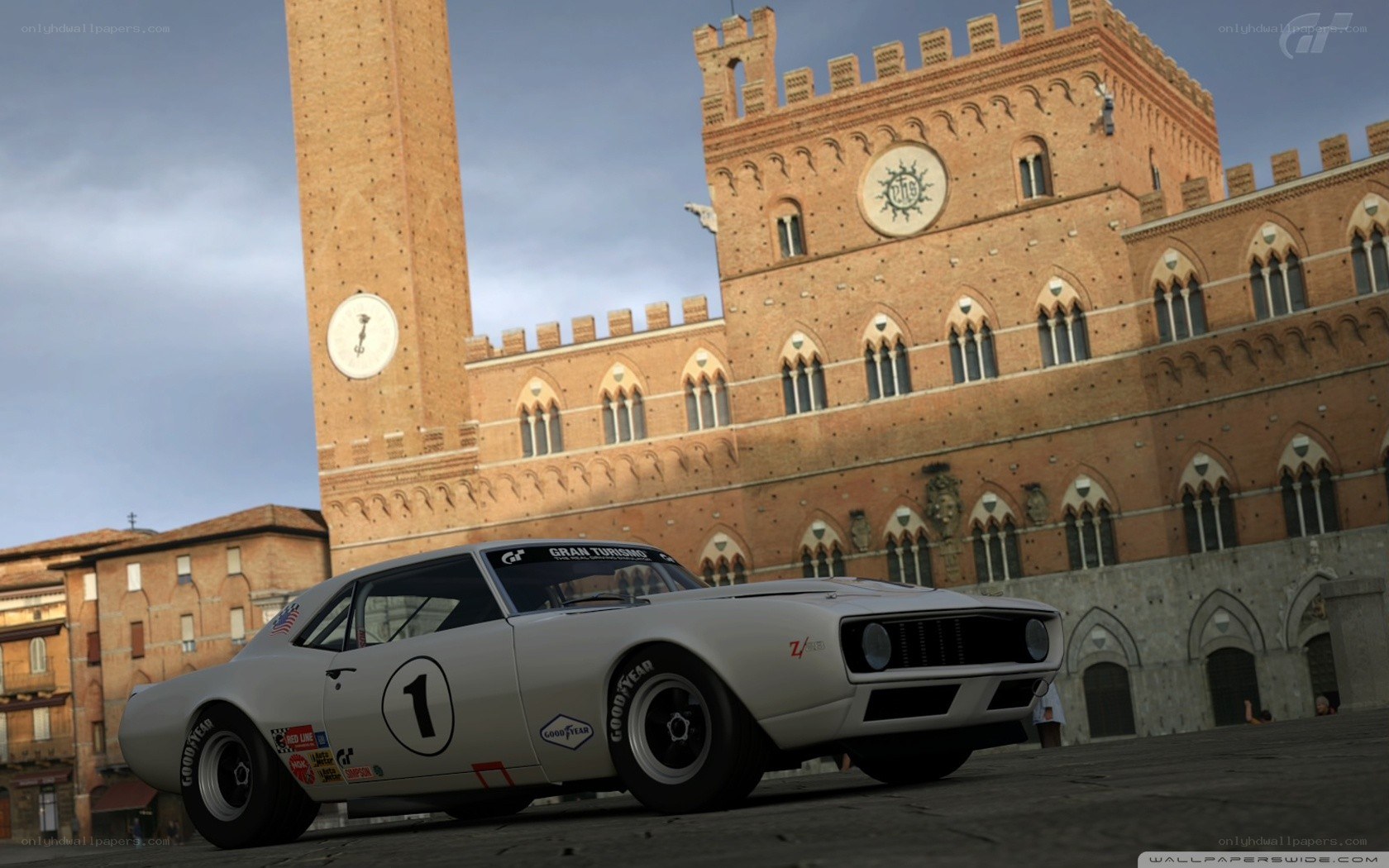 White race car in a city square