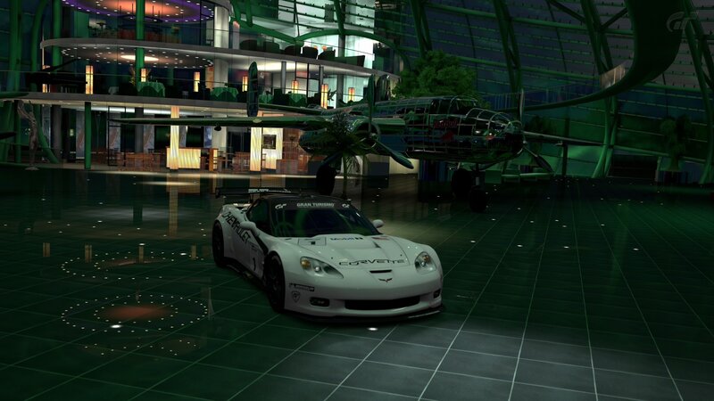 White race car in a hangar