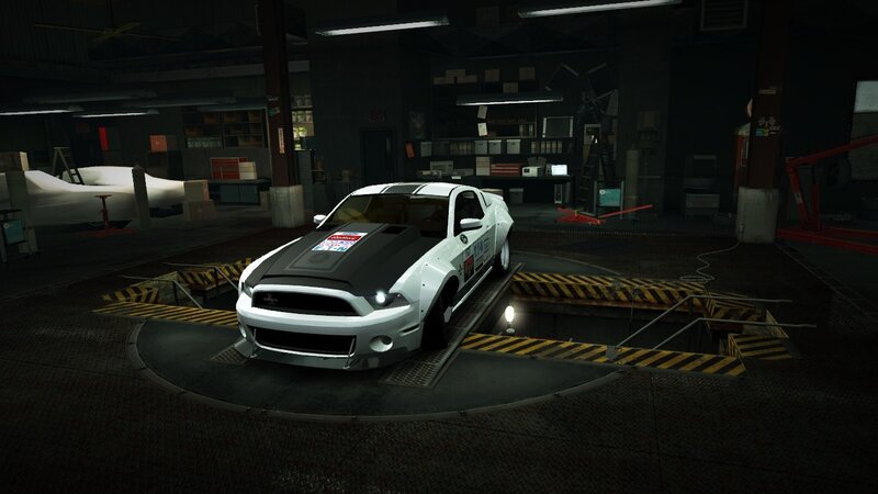 white race car in garage