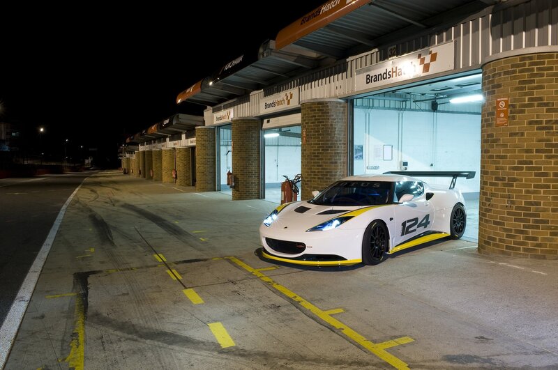 White Race Car in Garage — Dramatic, Night