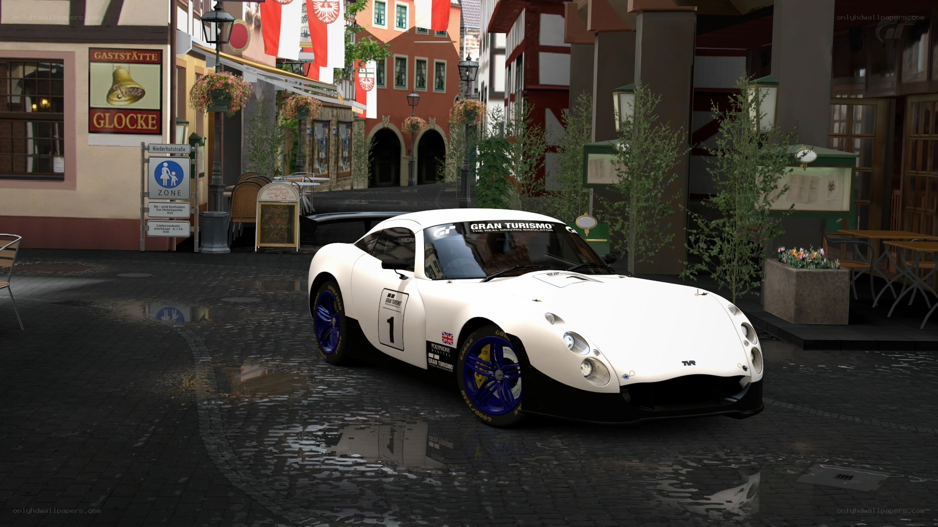 White race car in town square
