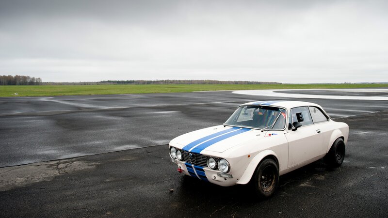 White race car on a runway