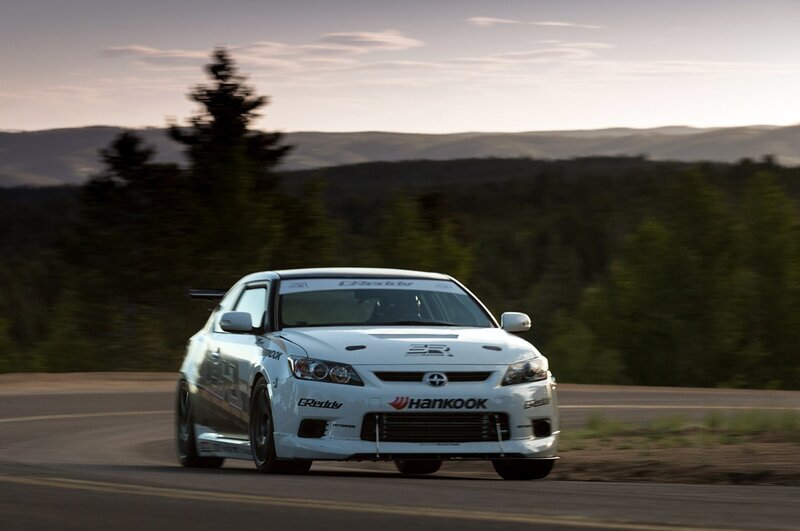 white race car on a winding road