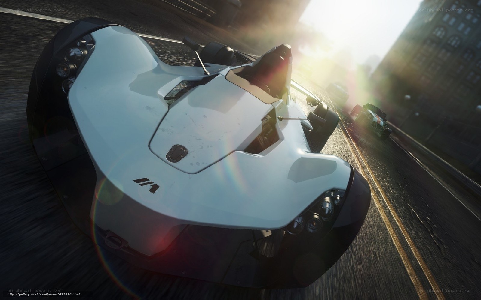 White race car on city street