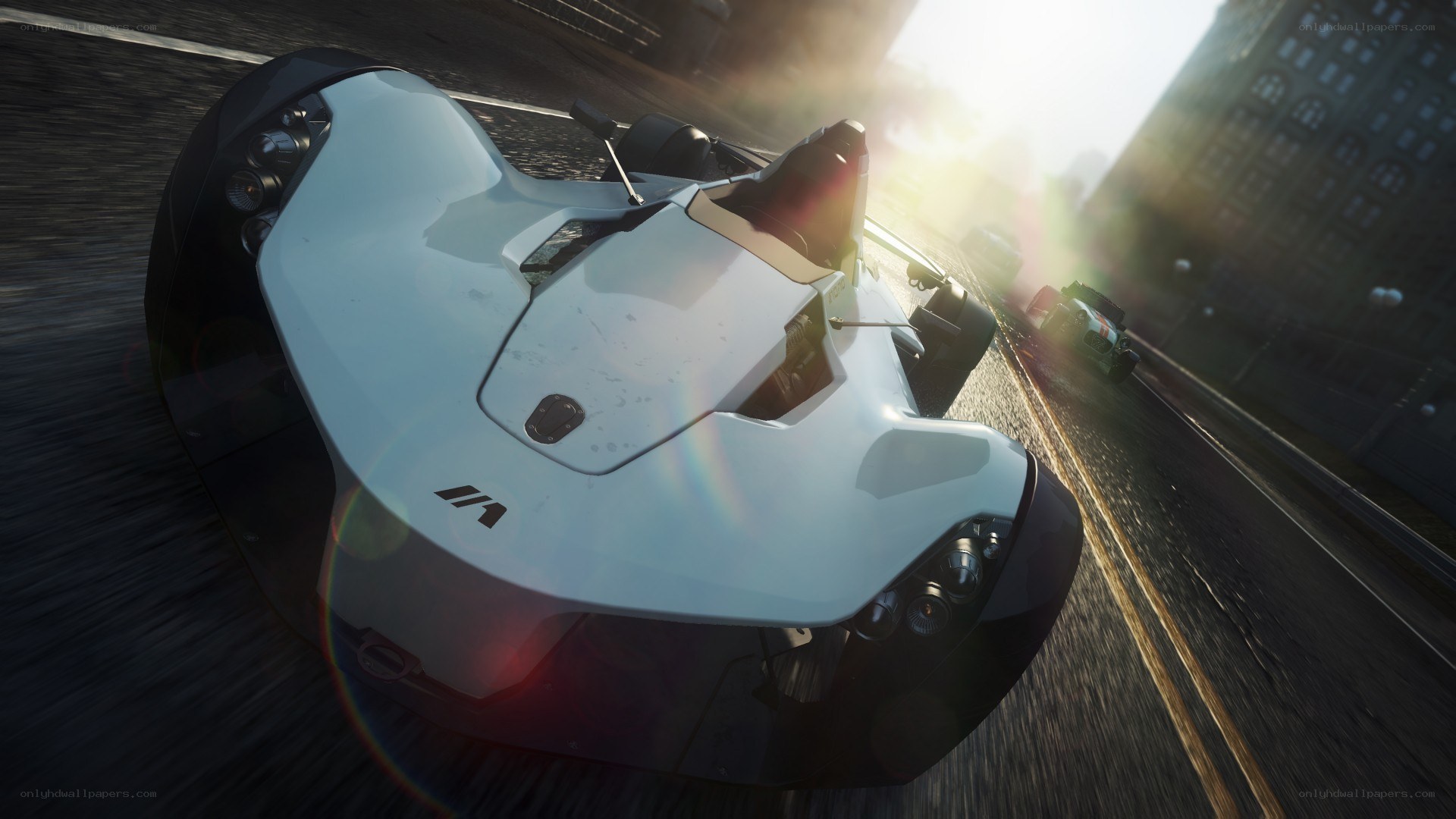 White race car on city street