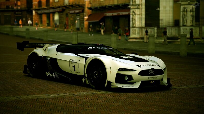 white race car on cobblestone street