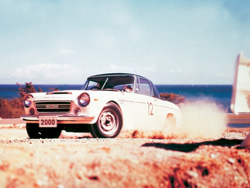 White race car on dirt track