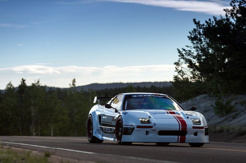white race car on mountain road