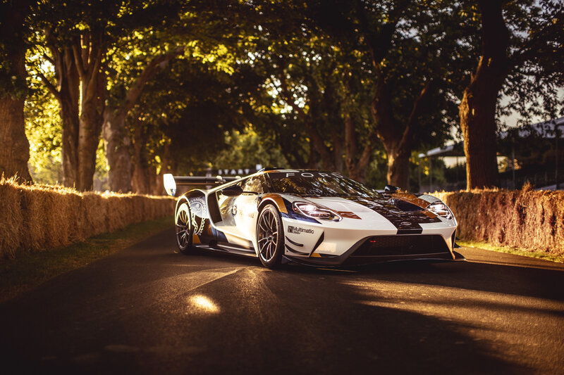 White Race Car on Road — Dramatic, Sunset, Photograph
