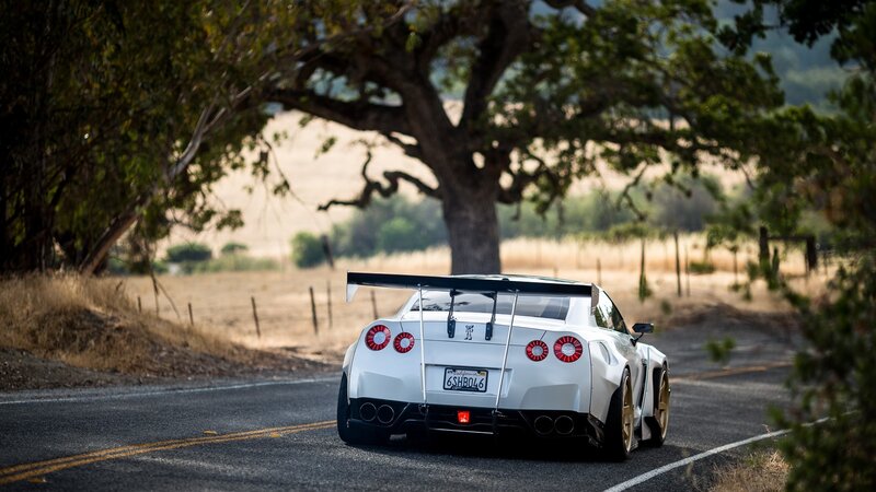 White Race Car on Road — Serene, Afternoon