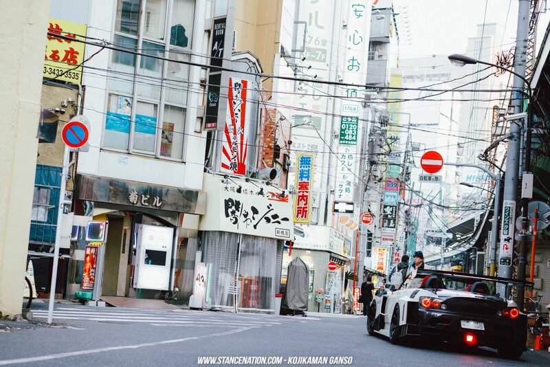 White Race Car on Street — Gray