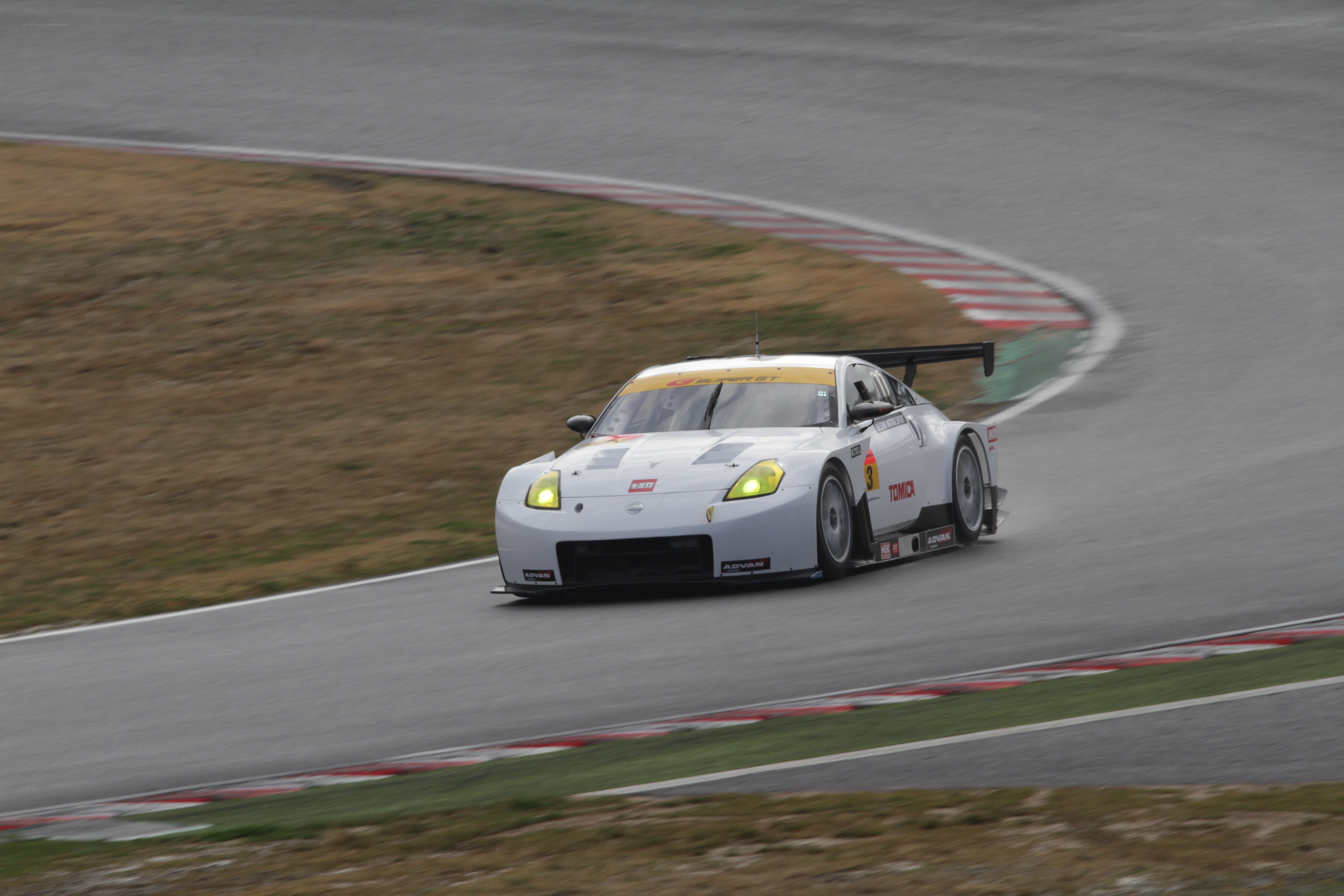 white race car on track
