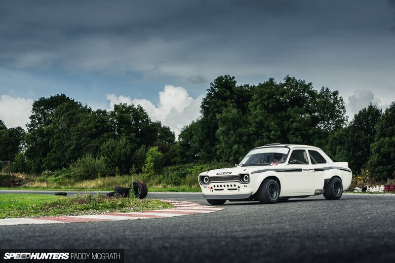 White Race Car on Track — Dramatic, Afternoon, Photograph, Trees